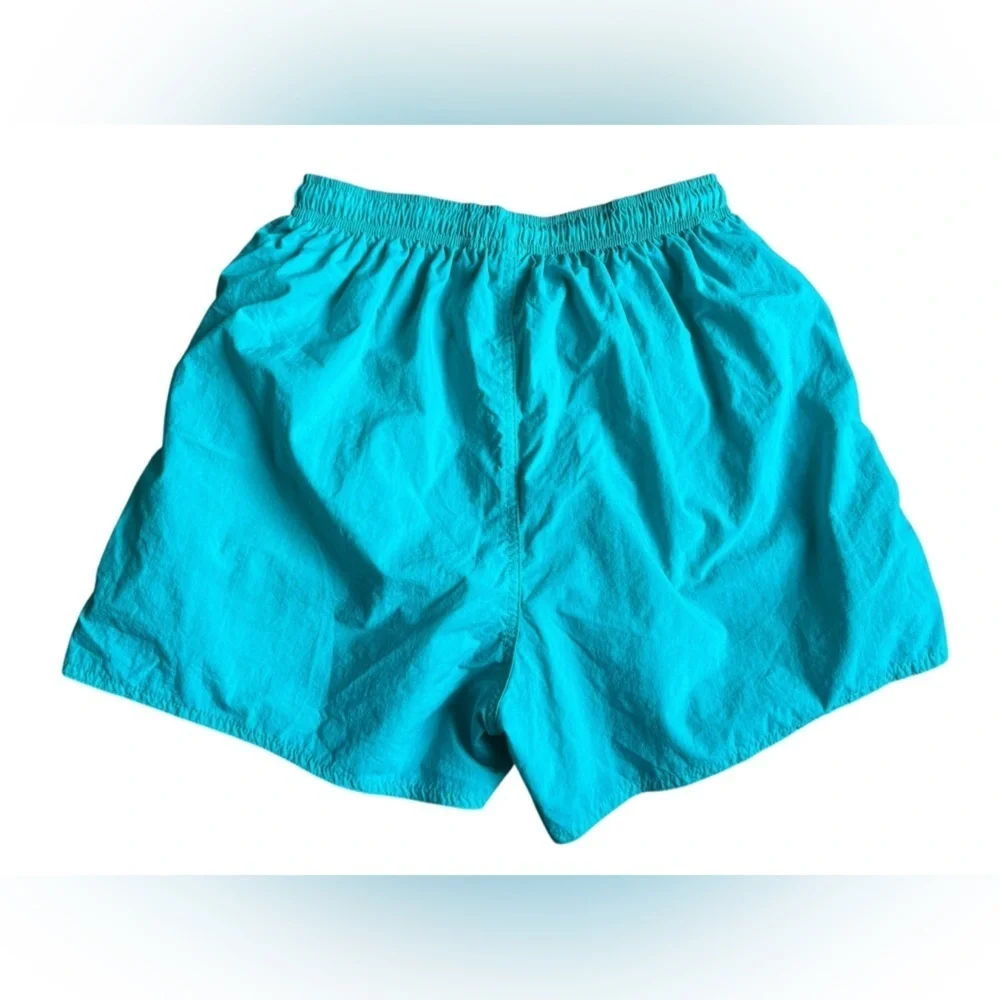 Nike women’s teal nylon short size medium.